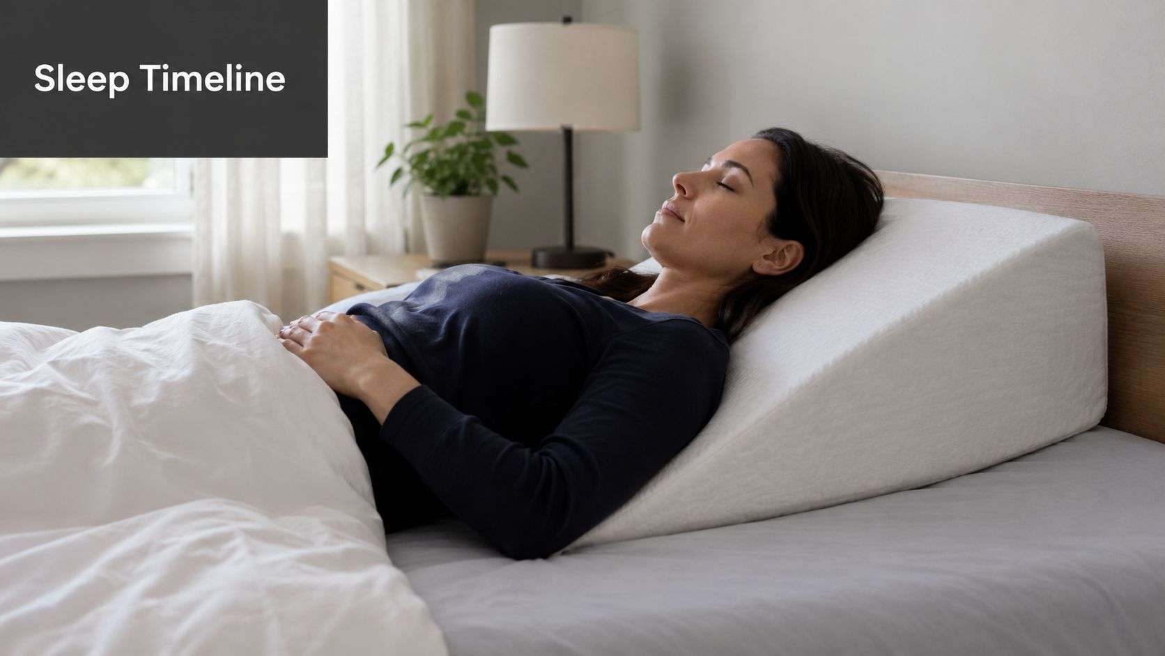 A woman sleeping comfortably in bed using an elevated wedge pillow for support and recovery.