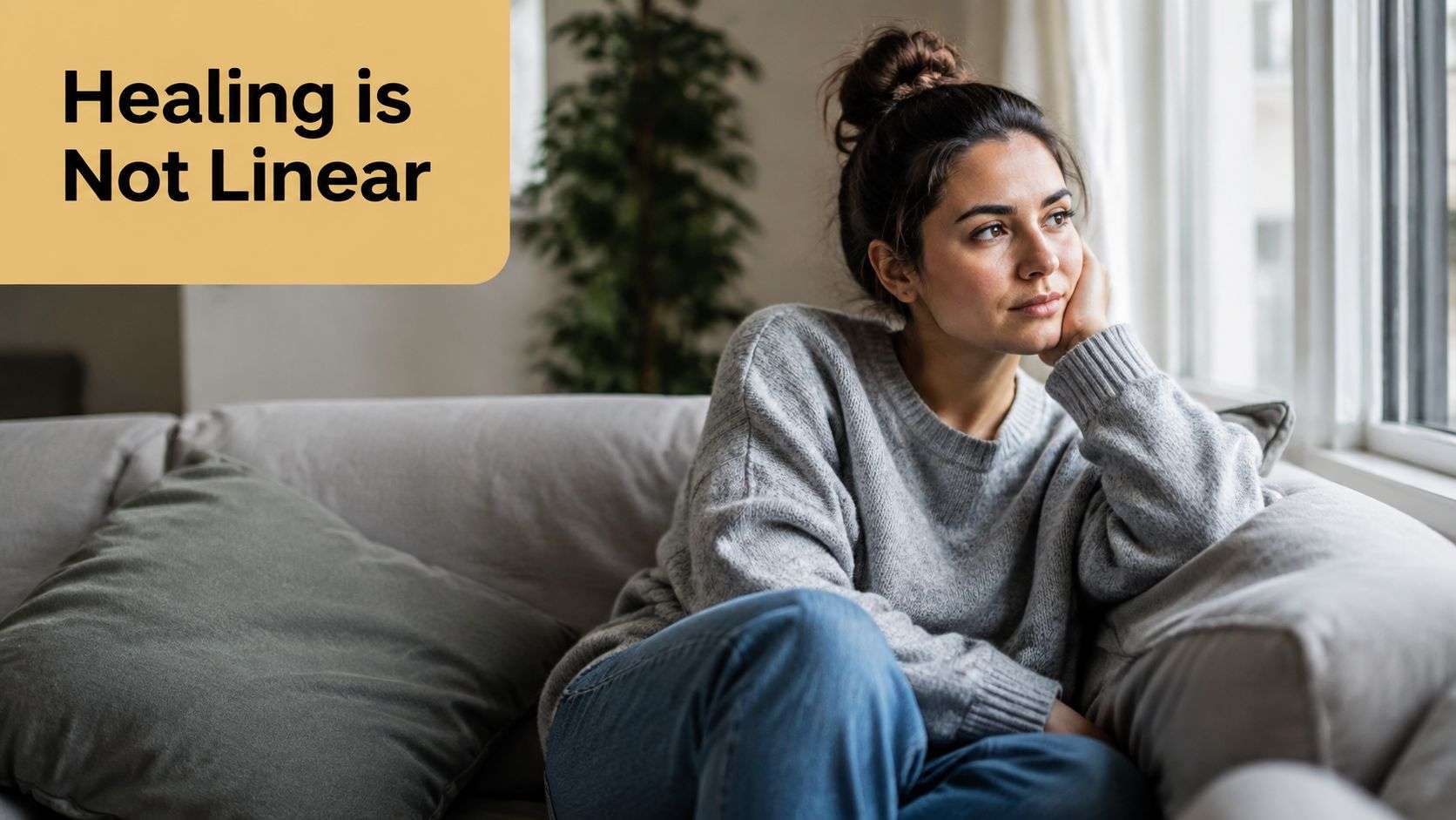 A contemplative woman sitting on a couch looking out a window with text Healing is Not Linear.